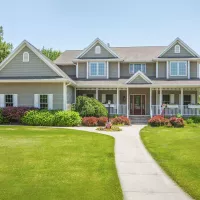 House with healthy green lawn