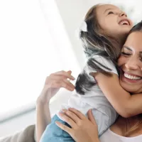 Mother and daughter laughing