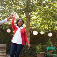older couple dancing outside in yard