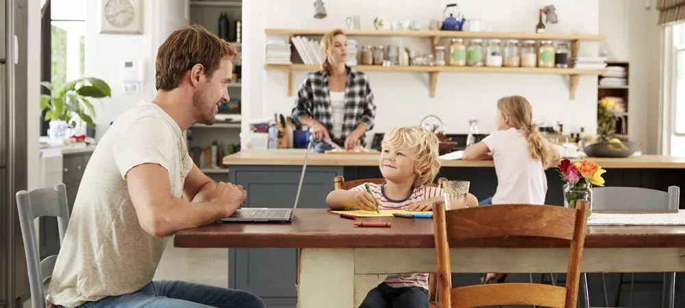 Father and son coloring in kitchen