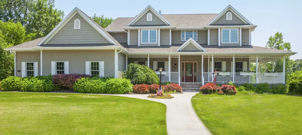 House with healthy green lawn