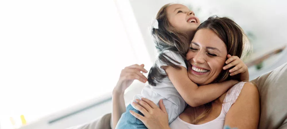 Mother and daughter laughing