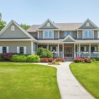 House with healthy green lawn